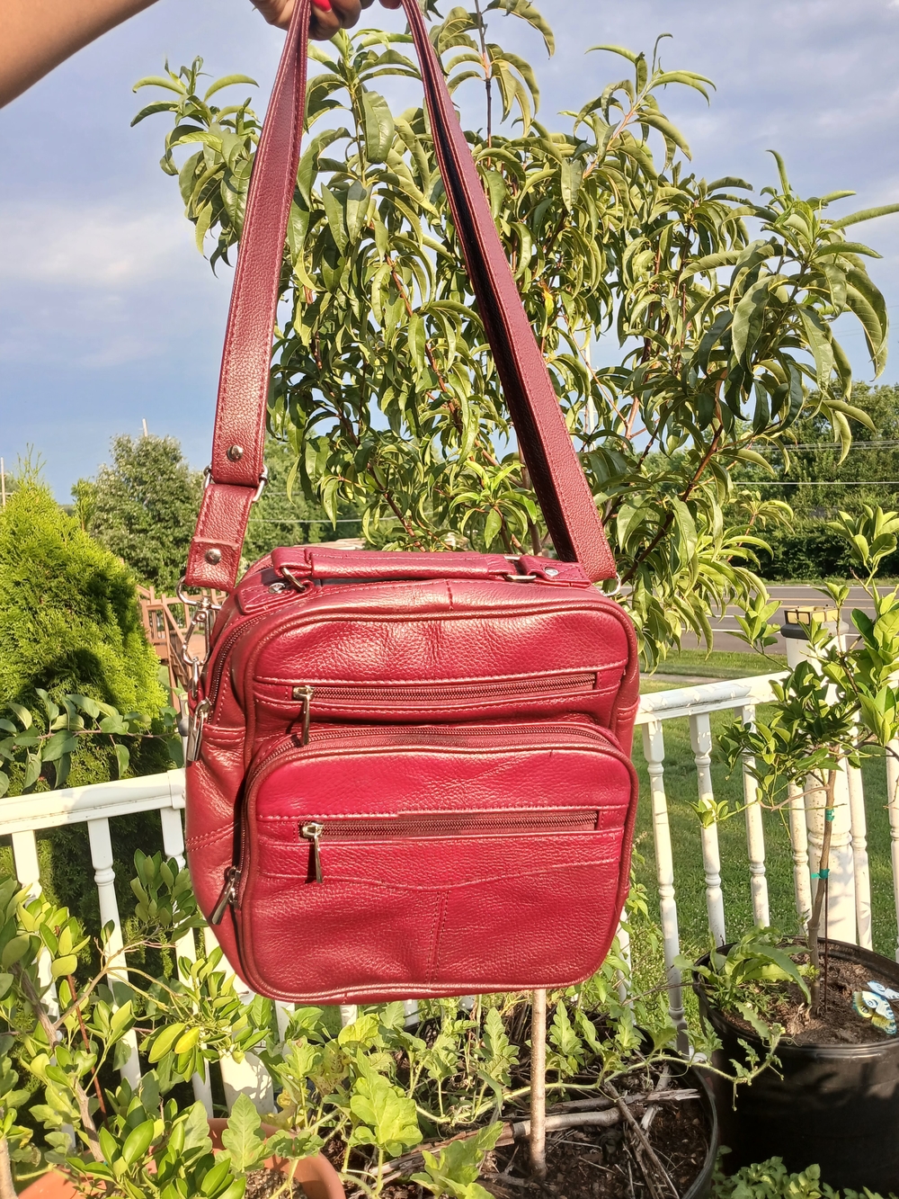 Classic Red Leather Messenger Bag with Multiple Zip Pockets